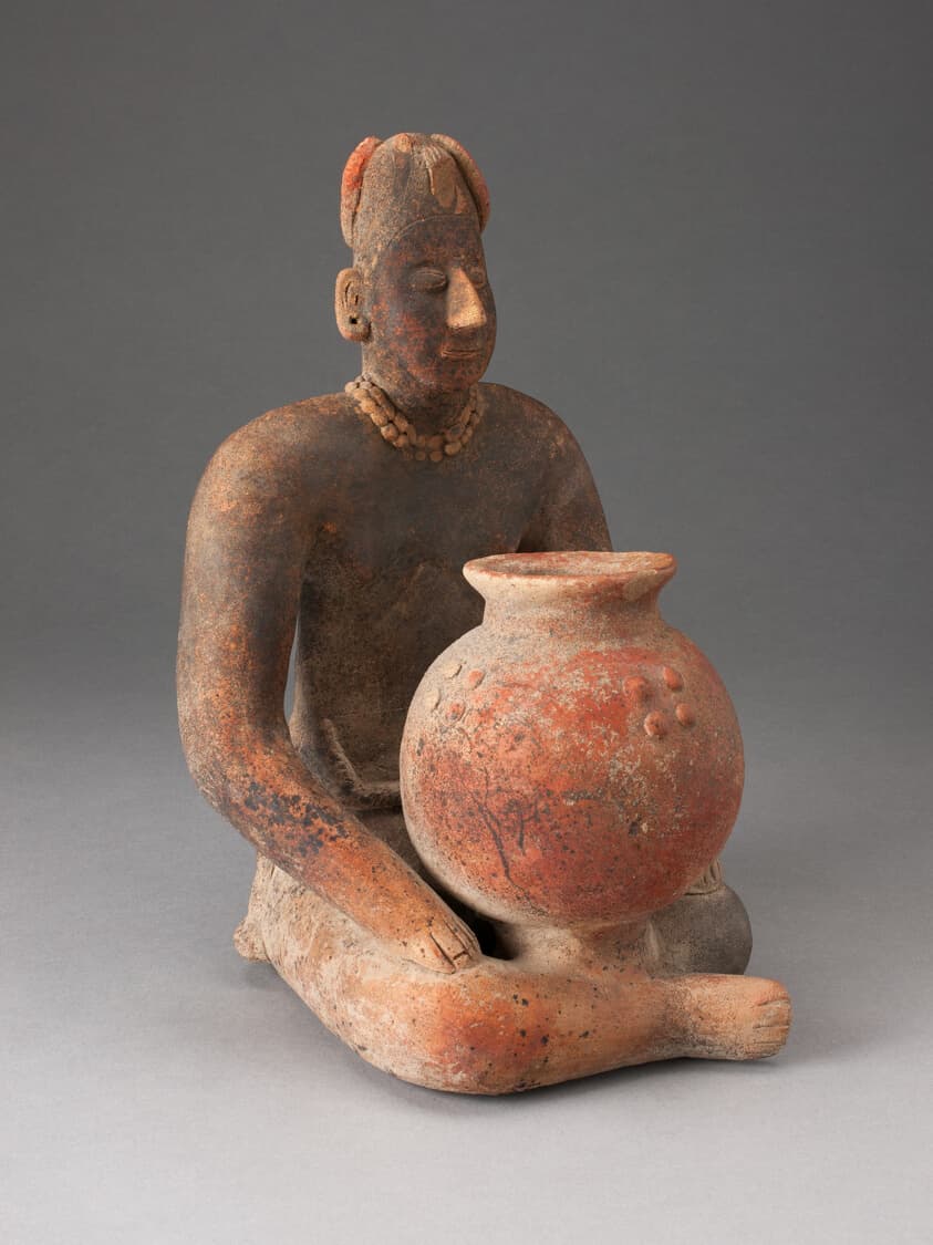 Seated Female Figure Holding a Vessel