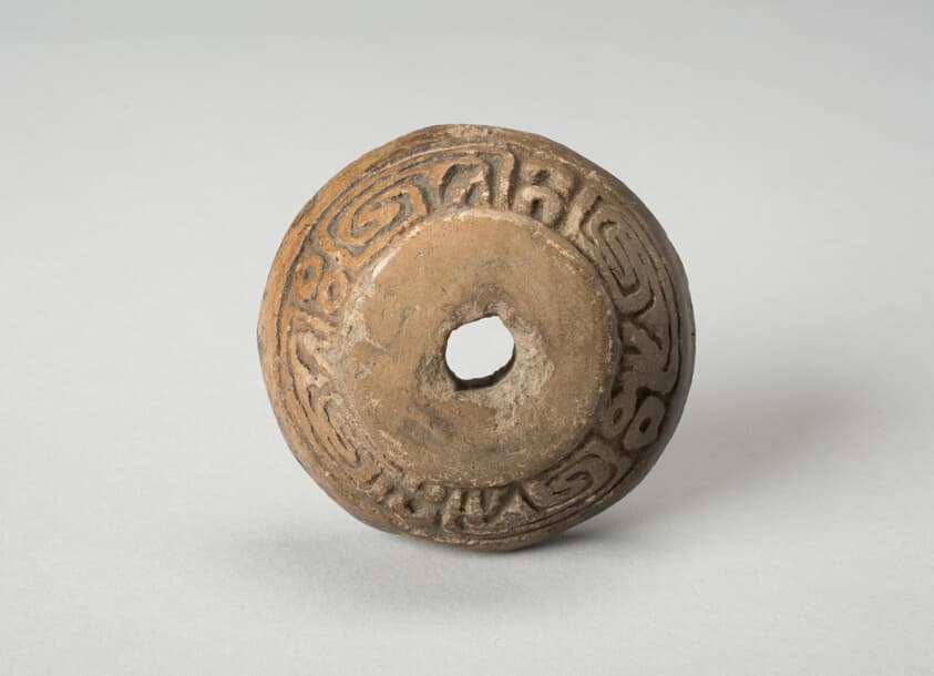 Ear Ornament or Spindle Whorl with Modeled Design