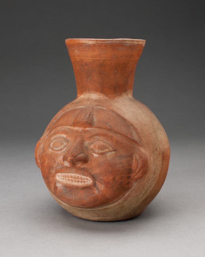 Jar in the Form of a Human Head with Face Painting and Showing Teeth