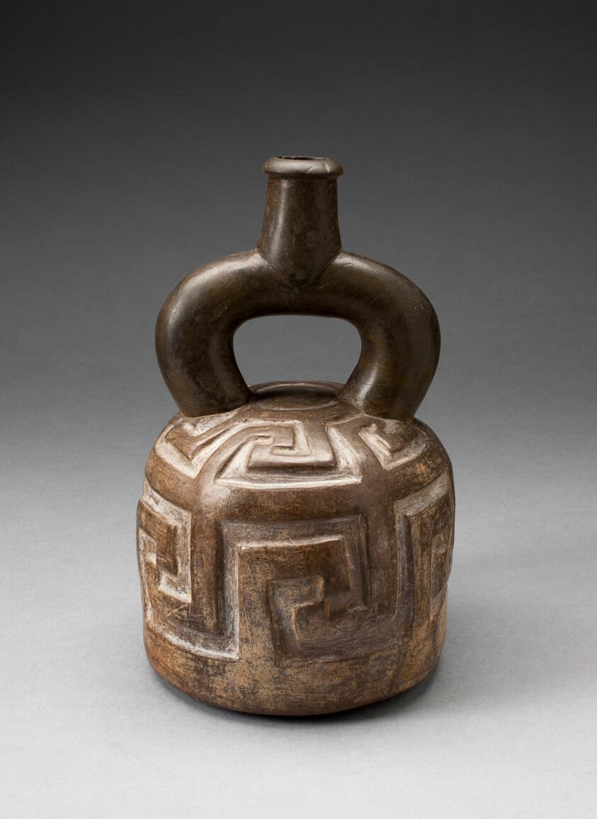 Stirrup Spout Vessel with Raised Geometric Scroll Motif