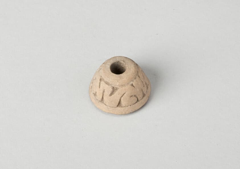 Ear Ornament or Spindle Whorl with Modeled Design