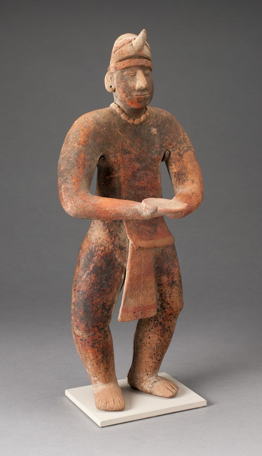 Standing Male Figure Holding a Plate